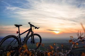Naklejka na ściany i meble Bicycle silhouettes with sky on sunsets time.
