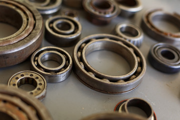old bearings on a wooden background close up