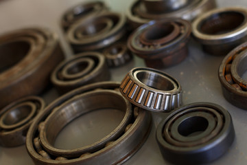 old bearings on a wooden background close up