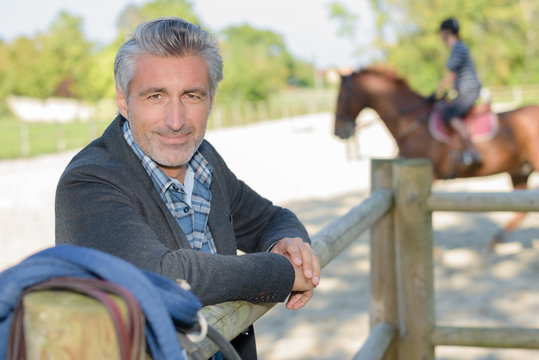 Portrait of man in equestrian arena