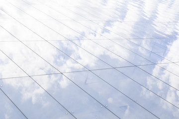 Glass building with sky reflection