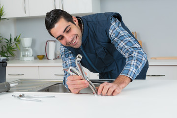 plumber fixing a faucet