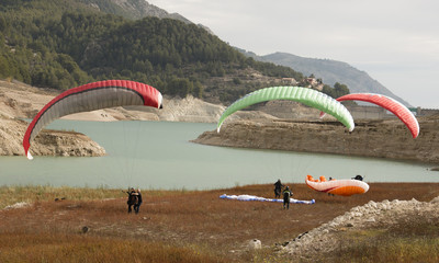 Paragliders by the lake