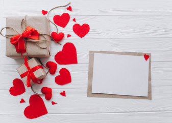 Valentine's Day. love letter, presents, heart felt and decor on wooden background
