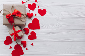 Valentine's Day. presents, heart felt and decor on wooden background - obrazy, fototapety, plakaty