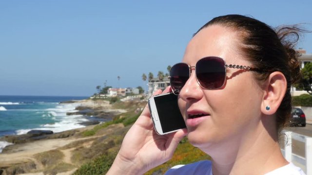 Video of woman talking on the phone in 4K. High quality video of woman talking on the phone in 4K