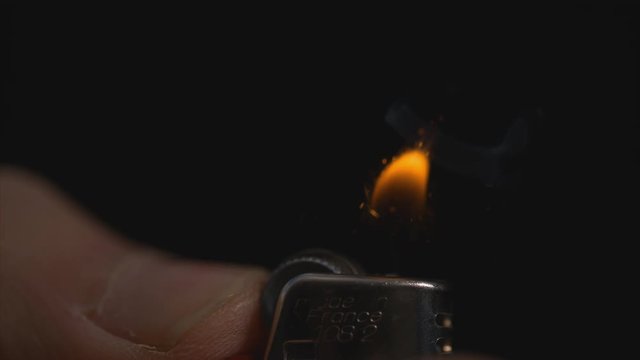 Lighter being lit in slow motion macro