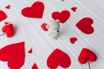 Valentine's Day. felt heart ,toys and decor on wooden background