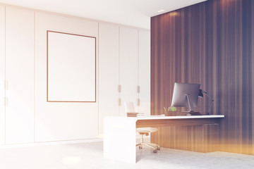 Corner of CEO office with framed poster, toned