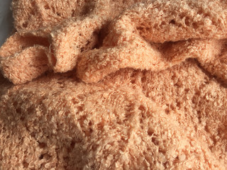 Beautiful crafted cream beige wool knitted background, natural soft surface