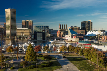 OCTOBER 28, 2016 - Baltimore Inner Harbor late afternoon lighting of ships and skyline, Baltimore, Maryland, shot from Federal Park Hill - obrazy, fototapety, plakaty