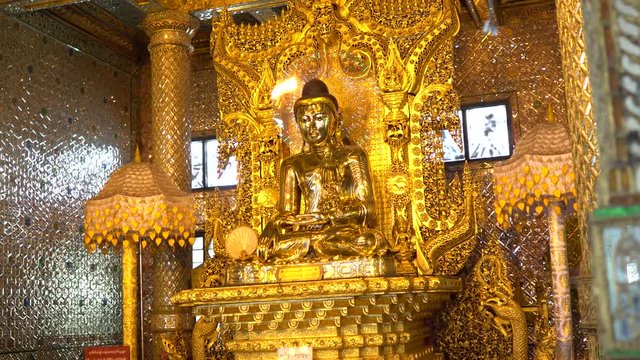 The golden image of Buddha in Botahtaung Pagoda in Yangon, Myanmar.