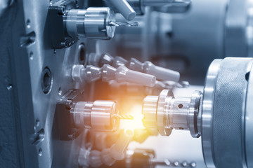 The CNC lathe or CNC turning machine while cutting sample part 