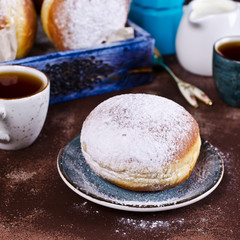 Traditional donuts with powdered sugar