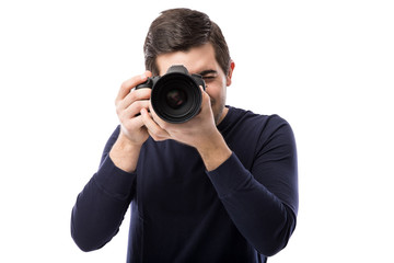 Male photographer using a dslr - obrazy, fototapety, plakaty