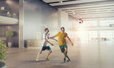 Obraz premium Playing football in office . Mixed media