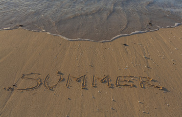 Summer 2017 written on the beach