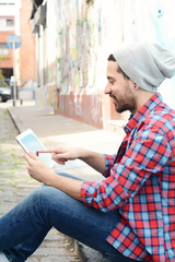 latin man using a tablet.