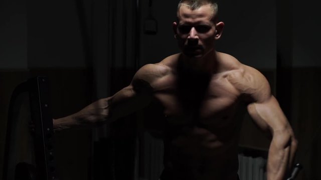 Brutal strong athletic men pumping up muscles workout bodybuilding concept background - muscular bodybuilder handsome men doing exercises in gym naked torso fitness and bodybuilding