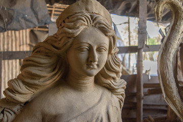 Unfinished clay idol of Hindu Goddess.