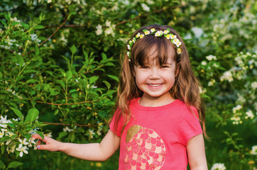 Cute little girl in an Apple orchard
