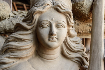 Fototapeta na wymiar Unfinished clay idol of Hindu Goddess.
