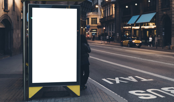 Blank advertising light box on bus stop, mockup of empty ad billboard on night bus station, template banner on background city street for poster or sign, afisha board and headlights of taxi cars.