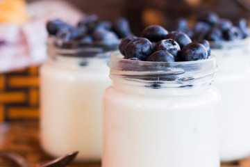 yogurt with blueberries in a glass jar