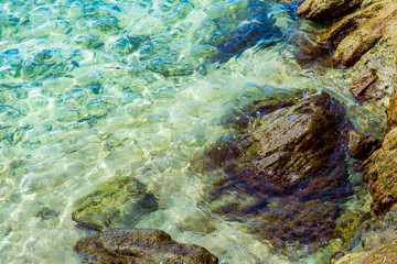 Blue sea and a moving reflection of sunlight