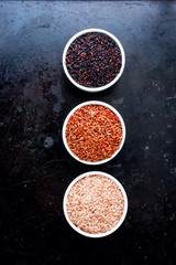 Three types of rice bran shell: black, brown, red on a black background