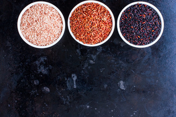 Three types of rice bran shell on a black background, horizontal