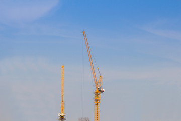 Fototapeta na wymiar tower crain construction building in blue sky