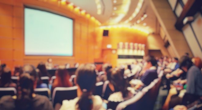 Blur of auditorium room use for present meeting background