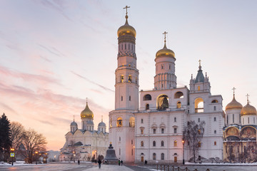 Fototapeta na wymiar Ivan the Great Bell tower and Kremlin Cathedrals at winter sunset in Moscow 