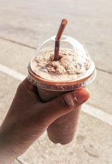 The ice chocolate twist  in the hand.