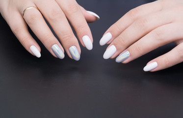 Beautiful natural nails, hand and ideal clean manicure. Decorated with stylish elements