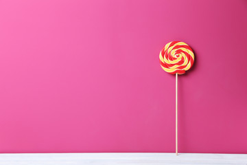 Sweet lollipop on a pink background