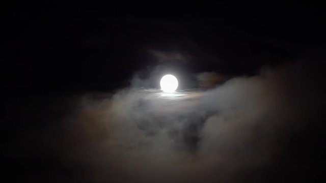 full moon with drifting clouds