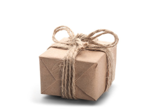 Boxes with gift wrapped in kraft paper on isolated white backgro