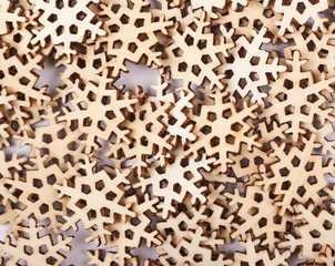 Surface covered with wooden snowflakes