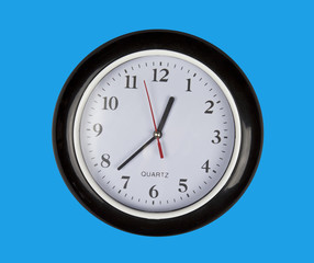 wall clock on blue