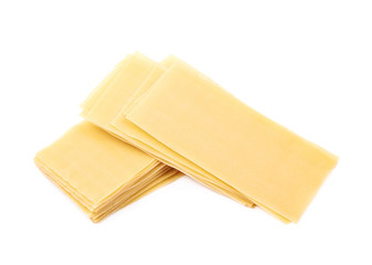 Pile of dried lasagna sheets isolated