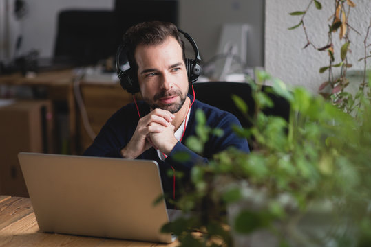 Smiley adult businessman while work