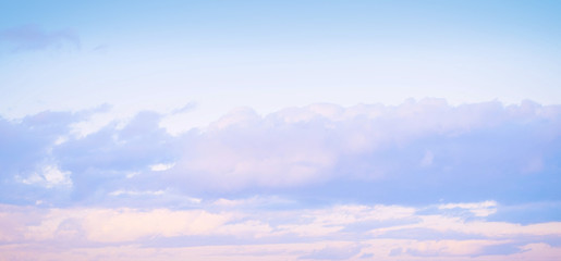 Sky background on sunset. Nature composition. Panoramic sunset sky background. Sunrise sky with lighted clouds. Beauty evening sunrise. 