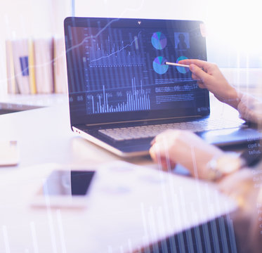 Business People Abstract Background Concept. Woman Pointing To Computer Screen With Sale Statistics