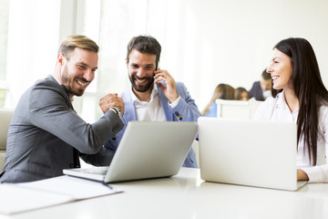 Young successful managers discussing new business project