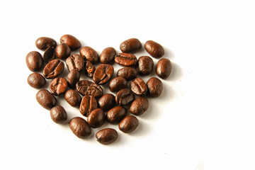 Heart shape made from coffee beans Isolated on white background