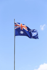 Australian flag flying on a flagpole.