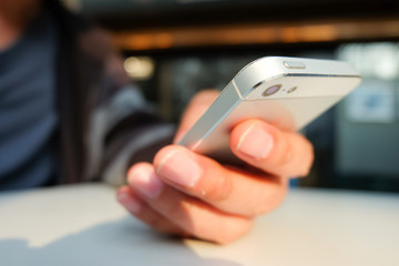 Close up of a man using mobile smart phone
