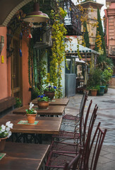 Tables in street cafe in the old town center of Tbilisi, Georgia